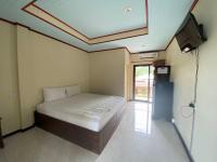 Postel nebo postele na pokoji v ubytování Rainbow Bungalow Haadrin Koh Phangan