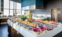 a buffet line with many different types of food at Hotel Mikołajki Leisure &amp; SPA in Mikołajki