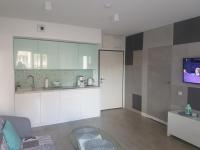 Televízia a/alebo spoločenská miestnosť v ubytovaní Apartament Horyzont 101