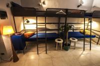 A bed or beds in a room at Ostello degli Elefanti