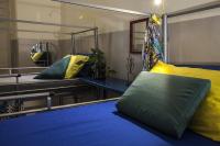 A bed or beds in a room at Ostello degli Elefanti