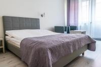 Posteľ alebo postele v izbe v ubytovaní Arka - pokoje z osobnymi wejściami na parterze