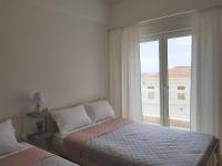 Posteľ alebo postele v izbe v ubytovaní Harmony Apartment Kavala