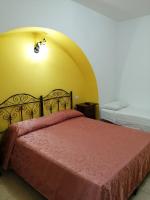 Łóżko lub łóżka w pokoju w obiekcie Agriturismo Tenuta Perruzzi