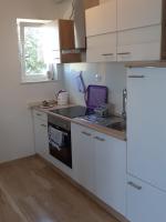 Kuchyňa alebo kuchynka v ubytovaní Apartman Lapis