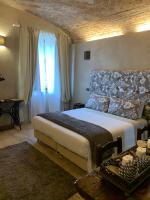 Łóżko lub łóżka w pokoju w obiekcie Corte degli Angeli Agriturismo