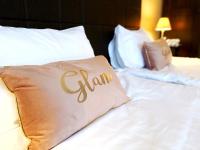 A bed or beds in a room at Royal Beach Premium