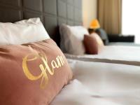 A bed or beds in a room at Royal Beach Premium