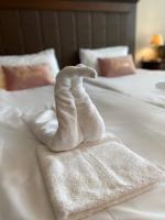 A bed or beds in a room at Royal Beach Premium