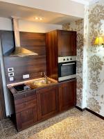 A kitchen or kitchenette at Royal Beach Premium