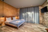 Posteľ alebo postele v izbe v ubytovaní Olive Luxury Suites - ADULTS ONLY