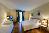 Posteľ alebo postele v izbe v ubytovaní Ambassador Palace Hotel