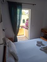Postel nebo postele na pokoji v ubytování Drosia Hotel