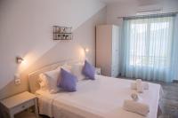 Posteľ alebo postele v izbe v ubytovaní Theodora Rooms