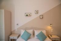 Posteľ alebo postele v izbe v ubytovaní Theodora Rooms