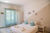 Posteľ alebo postele v izbe v ubytovaní Theodora Rooms