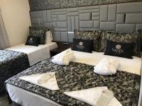Postel nebo postele na pokoji v ubytování Venus Hotel