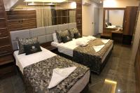 Postel nebo postele na pokoji v ubytování Venus Hotel