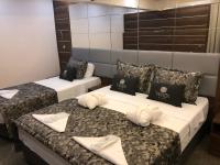 Postel nebo postele na pokoji v ubytování Venus Hotel