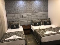 Postel nebo postele na pokoji v ubytování Venus Hotel