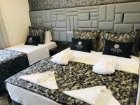 Postel nebo postele na pokoji v ubytování Venus Hotel