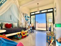 a childs room with a bed and toys in it at 晶藍色美人魚 Mermaid Inn in Hualien City