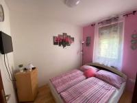 Posteľ alebo postele v izbe v ubytovaní Hellasz Apartman