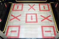 a floor with red crosses on it at Silom Space Hostel in Bangkok