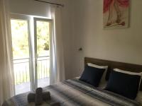Postel nebo postele na pokoji v ubytování RIVA Seafront holiday apartments
