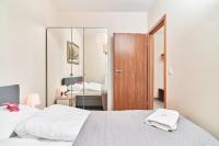 Posteľ alebo postele v izbe v ubytovaní Exclusive Apartments Marina by Noclegi Renters