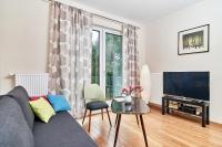 Televízia a/alebo spoločenská miestnosť v ubytovaní Exclusive Apartments Marina by Noclegi Renters