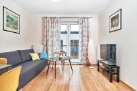 Televízia a/alebo spoločenská miestnosť v ubytovaní Exclusive Apartments Marina by Noclegi Renters