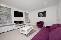 Televízia a/alebo spoločenská miestnosť v ubytovaní Lions apartment