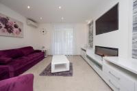Televízia a/alebo spoločenská miestnosť v ubytovaní Lions apartment