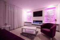 Televízia a/alebo spoločenská miestnosť v ubytovaní Lions apartment