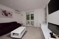 Televízia a/alebo spoločenská miestnosť v ubytovaní Lions apartment