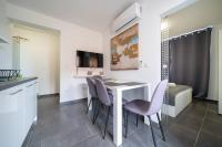 Televízia a/alebo spoločenská miestnosť v ubytovaní Holiday Apartments Amarilis