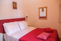 Łóżko lub łóżka w pokoju w obiekcie Hotel Pax