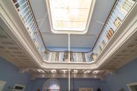 a large skylight in a building with a ceiling at Casa Patio del Panadero in Cádiz