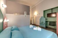 A bed or beds in a room at Al Consolato - Guest house