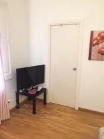 Televízia a/alebo spoločenská miestnosť v ubytovaní Apartment Aptucat
