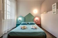 A bed or beds in a room at Al Consolato - Guest house