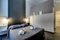 A bed or beds in a room at Al Consolato - Guest house