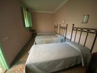 Postel nebo postele na pokoji v ubytování Hotel Peninsular