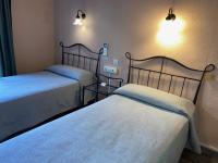 Postel nebo postele na pokoji v ubytování Hotel Peninsular