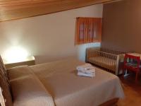 A bed or beds in a room at B & B Country House