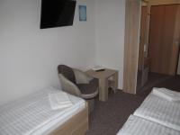 A bed or beds in a room at A+S Penzion Podzamok