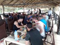 a group of people sitting at tables eating food at Hotel le Trarza in Niaga