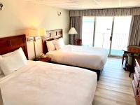 Atlantic Oceanfront Hotel, Wells Beachにあるベッド