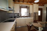 Kuchyň nebo kuchyňský kout v ubytování Theonymfi Luxury Villas